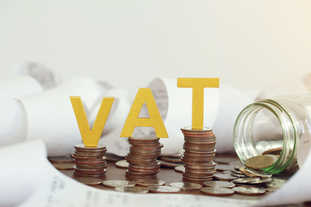 Vat Concept. Word vat put on stacked coins . Vat time
